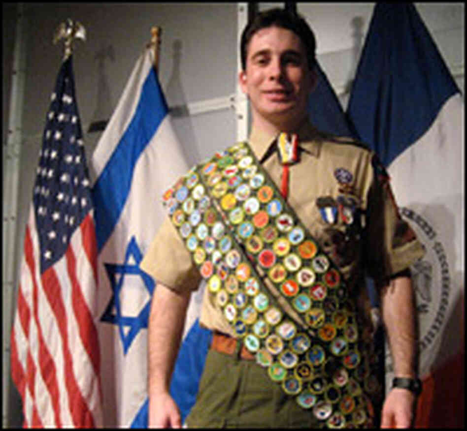 Scout Shawn Goldsmith shows off his merit badges. Scout Shawn Goldsmith shows off his merit badges.