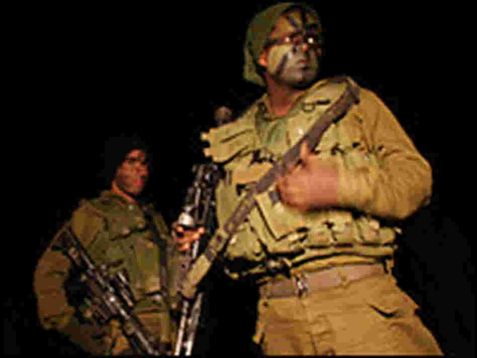 Israeli troops prepare to mobilize on Saturday on the Gaza/Israel border. Israeli troops prepare to mobilize on Saturday on the Gaza/Israel border.