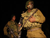Israeli troops prepare to mobilize on Saturday on the Gaza/Israel border.