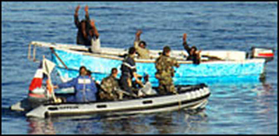 Sailors from theMaitre L'Her capture suspected Somali pirates in the Gulf of Aden on Jan. 1. Sailors from theMaitre L'Her capture suspected Somali pirates in the Gulf of Aden on Jan. 1.