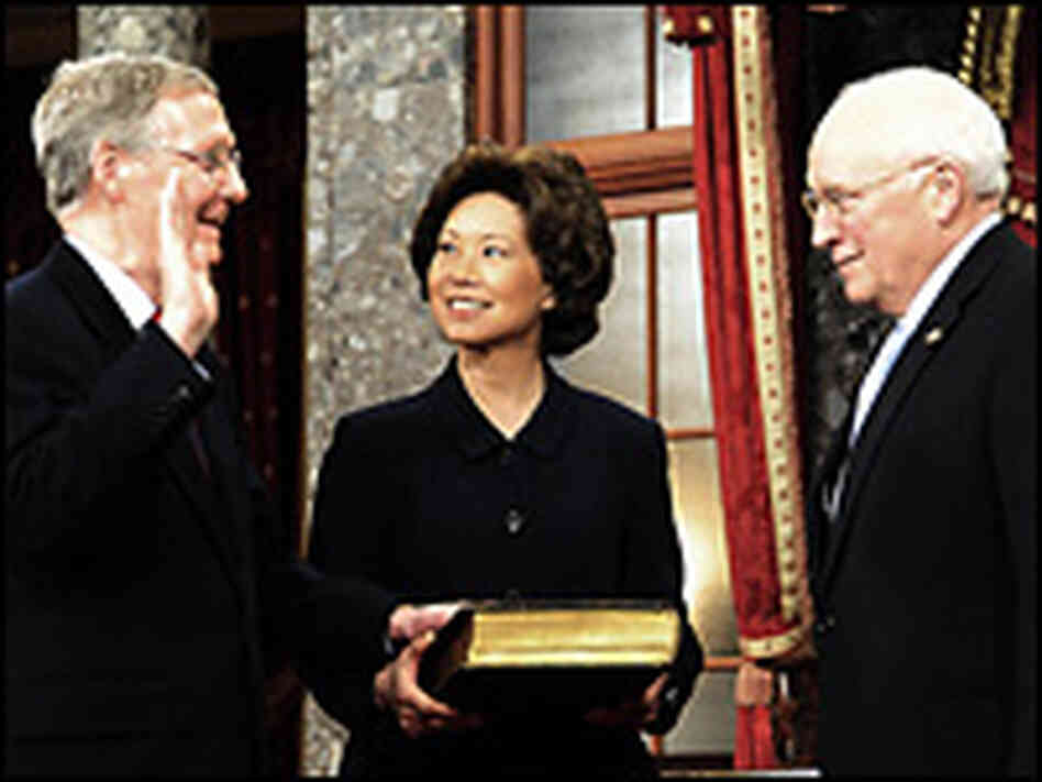 Sen. Mitch McConnell is sworn in by his wife, Labor Secretary Elaine Chao, and Vice President Cheney