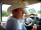 President Bush drives his pickup at his ranch in Crawford, Texas. President Bush drives his pickup at his ranch in Crawford, Texas.