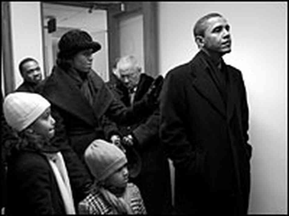 Barack Obama waits backstage at the Capitol in Springfield, Ill., with his wife and daughters.