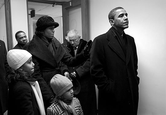 Barack Obama waits backstage at the Capitol in Springfield, Ill., with his wife and daughters.