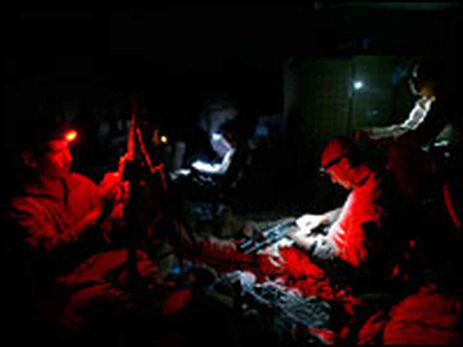 Marines clean their weapons.