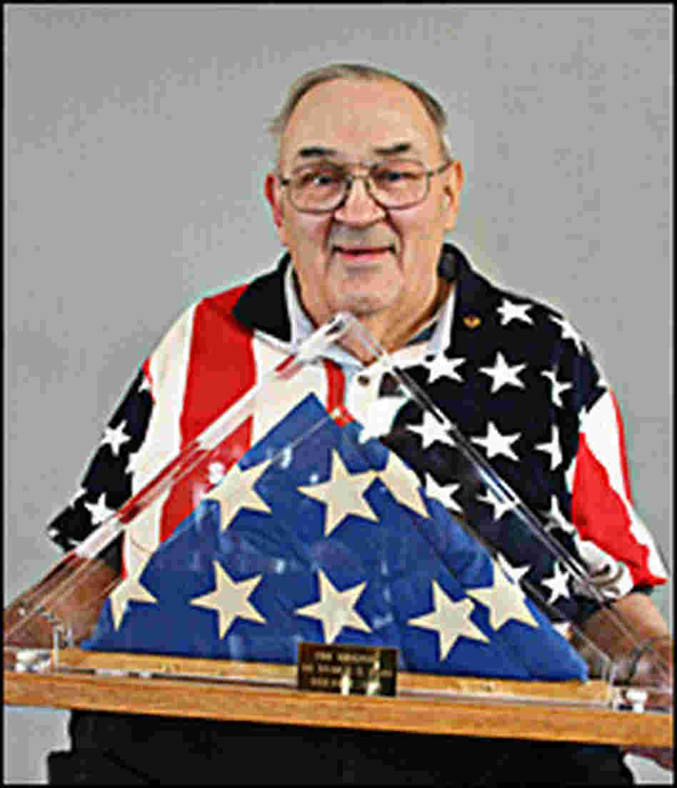 Bob Heft holds his original 50-star flag.
