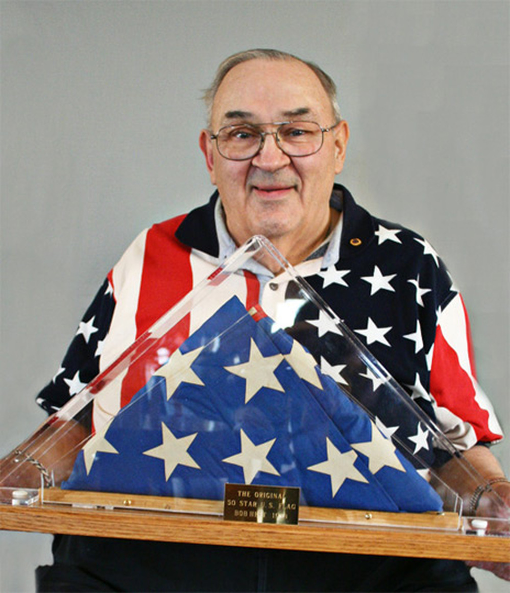 Bob Heft holds his original 50-star flag.