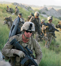 Fox Company marines, just off the helicopter, move to their positions. Credit: Graham Smith/NPR