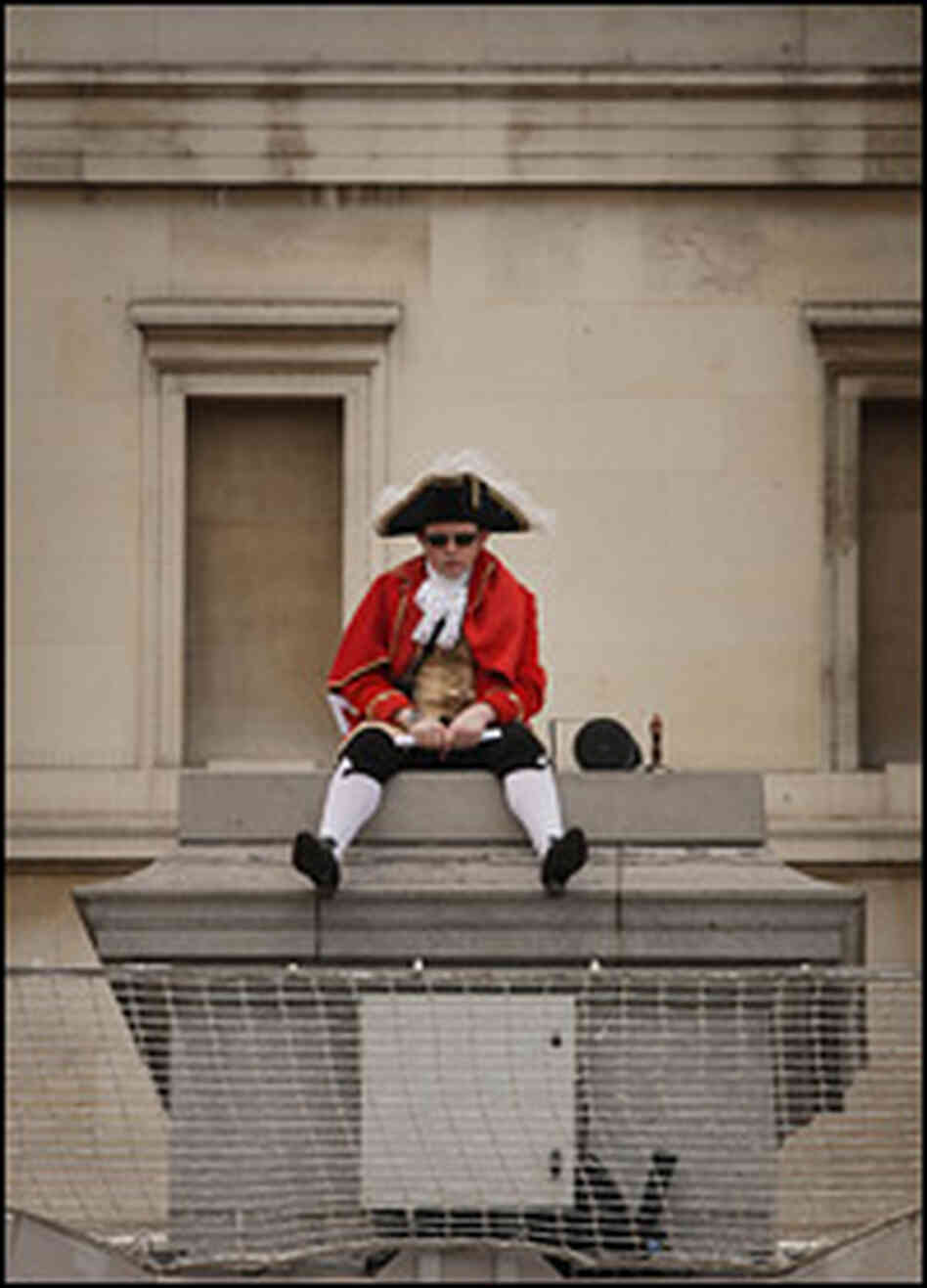 Bar owner Scott Illman sits on the empty fourth plinth in London's Trafalgar Square.