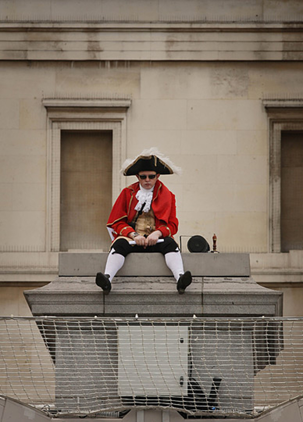 Bar owner Scott Illman sits on the empty fourth plinth in London's Trafalgar Square.