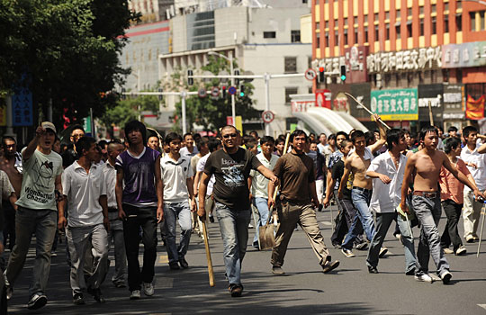 A group of Han Chinese carrying makeshift weapons roams the streets of Urumqi in Chinas far western Xinjiang region on Tuesday. Police fired tear gas to disperse thousands of Han Chinese protesters after weekend rioting that claimed at least 156 lives. AFP/Getty Images A group of Han Chinese carrying makeshift weapons roams the streets of Urumqi in Chinas far western Xinjiang region on Tuesday. Police fired tear gas to disperse thousands of Han Chinese protesters after weekend rioting that claimed at least 156 lives. AFP/Getty Images