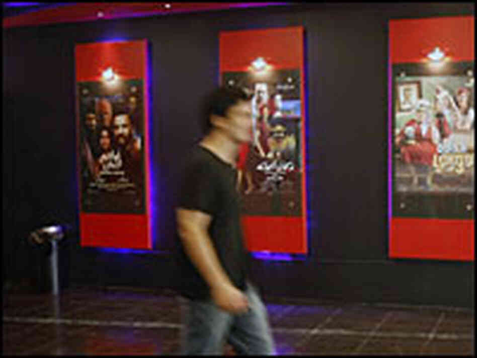 A Palestinian man walks through the lobby of the Cinema City theater in Nablus