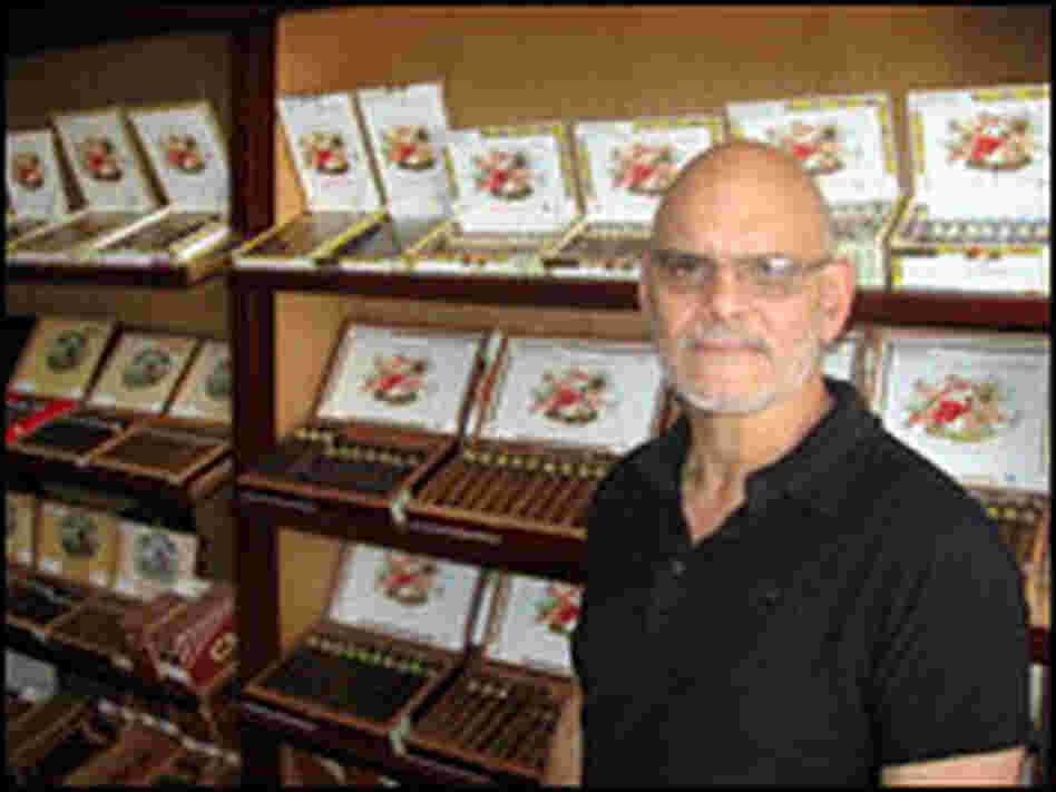 Ernesto Perez-Carrillo stands with the product that made him famous: his La Gloria Cubana cigars.