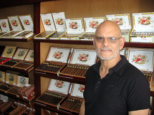 Ernesto Perez-Carrillo stands with the product that made him famous: his La Gloria Cubana cigars.