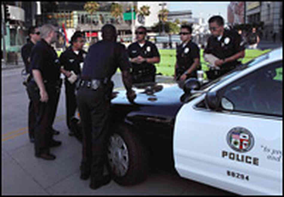 Los Angeles police discuss their day's assignments around the Staples Center on July 6.