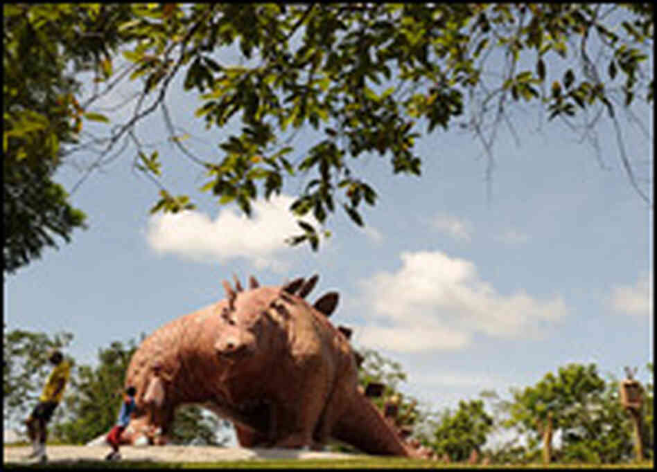Two children play in the "Jurassic Park" at Hacienda Napoles