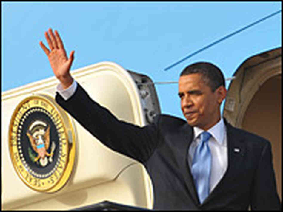 President Obama waves as he boards Air Force One at King Khalid international airport in Riyadh