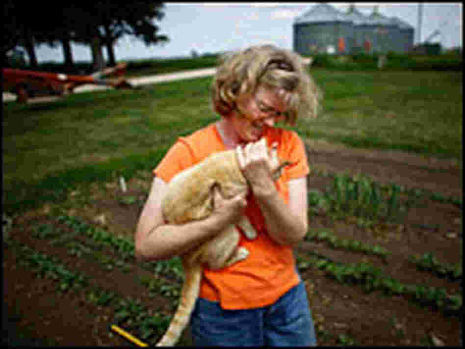 Lorna Wilson pauses while hoeing the garden on the Wilson family farm in Paullina.