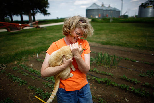 Lorna Wilson pauses while hoeing the garden on the Wilson family farm in Paullina.