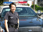 Officer Julie Sohn pictured in front of a patrol car near Koreatown in Los Angeles. Officer Julie Sohn pictured in front of a patrol car near Koreatown in Los Angeles.
