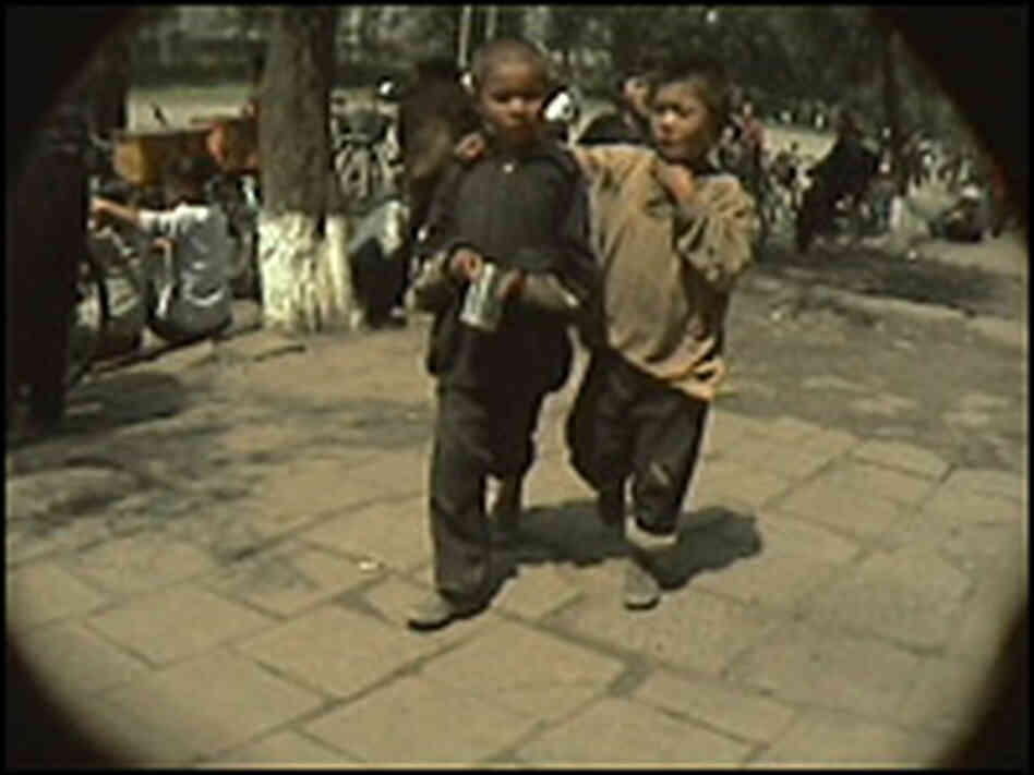 Two street urchins in Chongjin, North Korea Two street urchins in Chongjin, North Korea