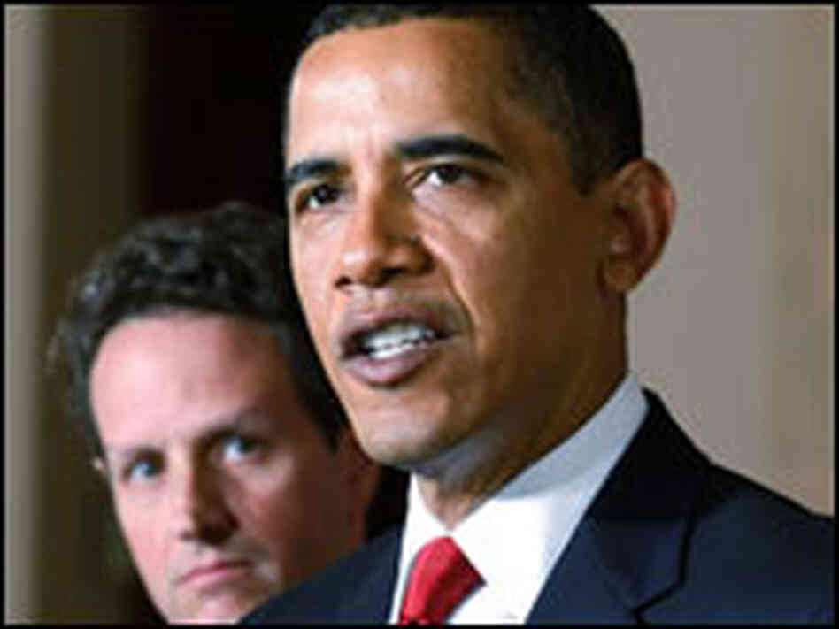 President Obama speaks as Treasury Secretary Timothy Geithner looks on.
