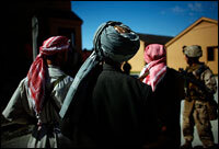 Actors play the role of translators, villagers and the Taliban during a training patrol at Camp Lejeune. The Marines are preparing for austere conditions in Afghanistan and communications with families back home will be difficult.