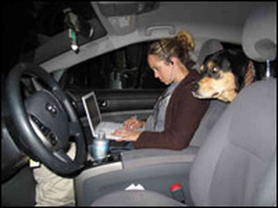 Caitlin in the car with her computer
