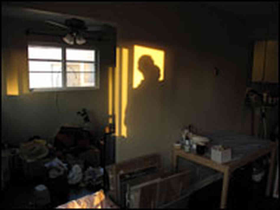 Dan and the baby in their old L.A. apartment