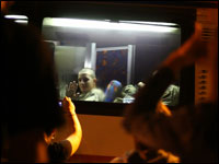 Lance Cpl. Josh Apsey, 18, waves and blows kisses to his family after boarding a bus for the first leg of his trip to Afghanistan on Saturday.
