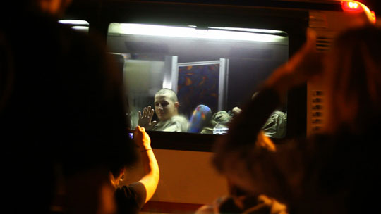 Lance Cpl. Josh Apsey waves as he starts out on his trip to Afghanistan. John Poole/NPR