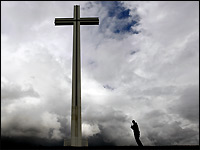 A man looks at the People Cross in Phoenix Park in Dublin.