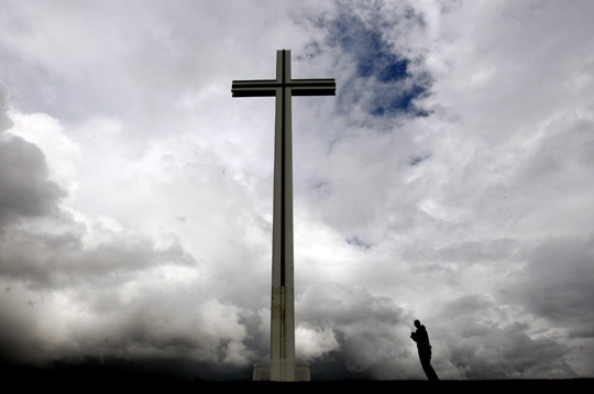 A man looks at the People Cross in Phoenix Park in Dublin.