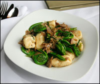 A dish containing fiddlehead ferns