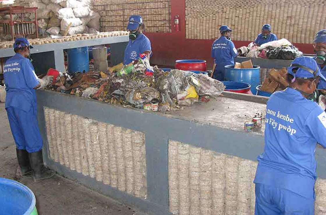 Workers at a recycling plant