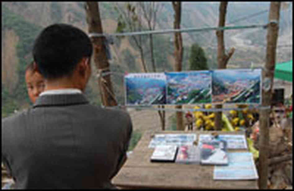 Photos of Beichuan's county seat before and after the earthquake are for sale on a hillside.