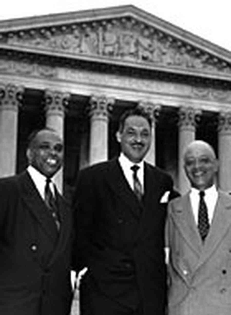 George E.C. Hayes, Thurgood Marshall, and James Nabrit Jr. in front of the Supreme Court building. George E.C. Hayes, Thurgood Marshall, and James Nabrit Jr. in front of the Supreme Court building.
