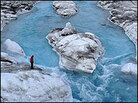 A scientist at a glacier in Greenland.