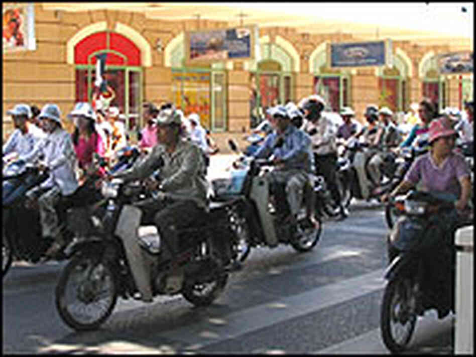 Motorbike traffic in downtown Hanoi -- on a light day. Motorbike traffic in downtown Hanoi -- on a light day.