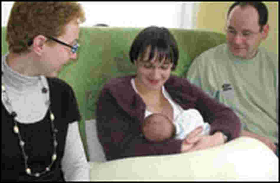 Nurse visits parents and child.
