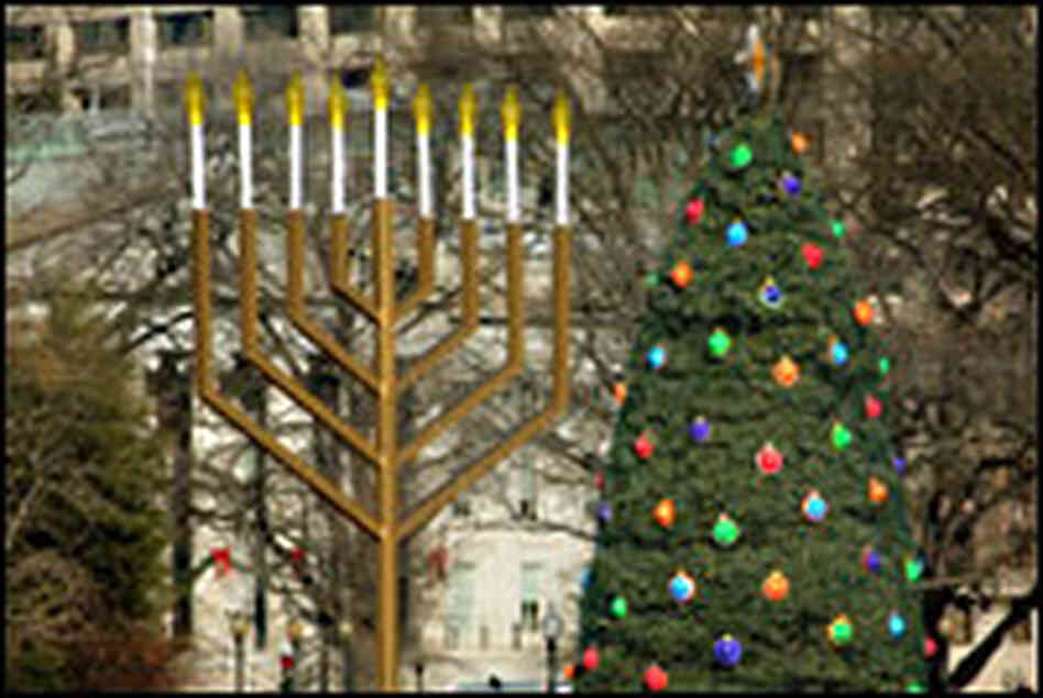A large menorah and the National Christmas Tree mark the holiday season in front of the White House. A large menorah and the National Christmas Tree mark the holiday season in front of the White House.