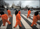 Demonstrators representing prisoners walk in a rally against torture on the National Mall. Demonstrators representing prisoners walk in a rally against torture on the National Mall.