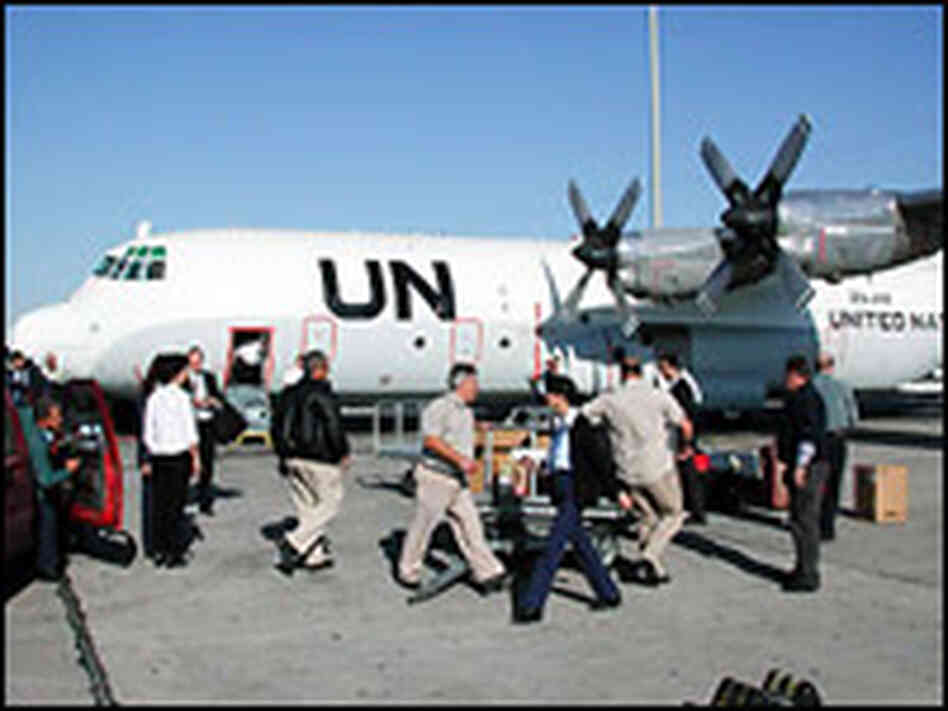 U.N. inspectors deplane in Iraq in Nov. 2002. Credit: Mark Gwozdecky-IAEA. U.N. inspectors deplane in Iraq in Nov. 2002. Credit: Mark Gwozdecky-IAEA.