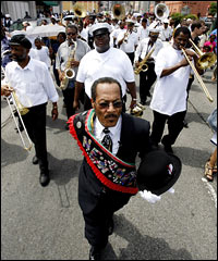 Members of the Algiers Brass Band play in a jazz funeral procession in New Orleans to mark the one-year anniversary of Hurricane Katrina, Aug. 29, 2006.
