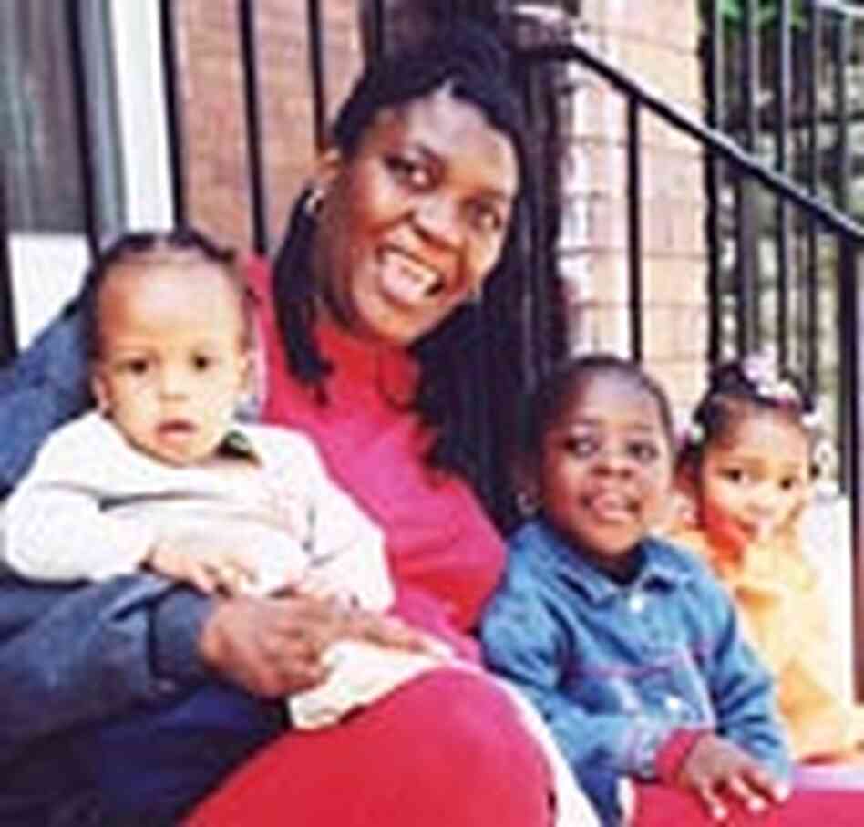 Laressa Matthews with three of the eight children in her home daycare center Laressa Matthews with three of the eight children in her home daycare center