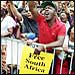 A Brooklyn crowd cheers for Nelson Mandela during his June 1990 U.S. trip, shortly after he was released after spending 27 years in a South African prison. Credit: © David Turnley/CORBIS