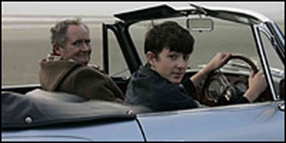 Jim Broadbent and Matthew Beard (driving on beach)