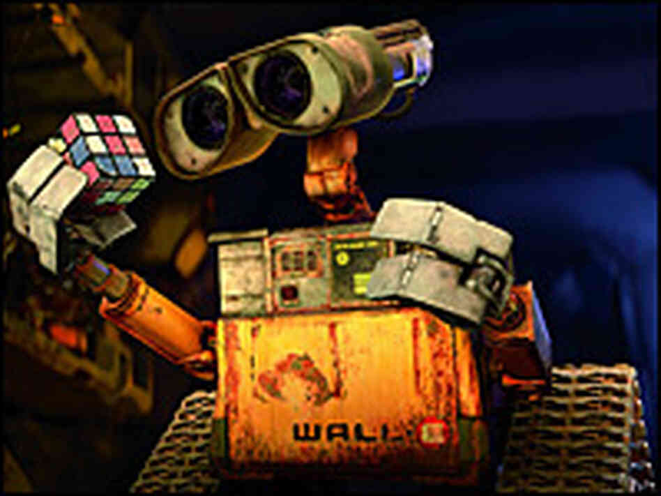 WALL-E gazes at a Rubik's Cube.