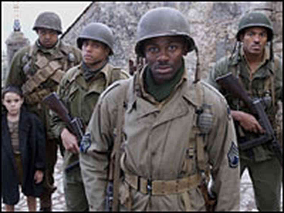 The army unit flanks the Italian kid they've rescued