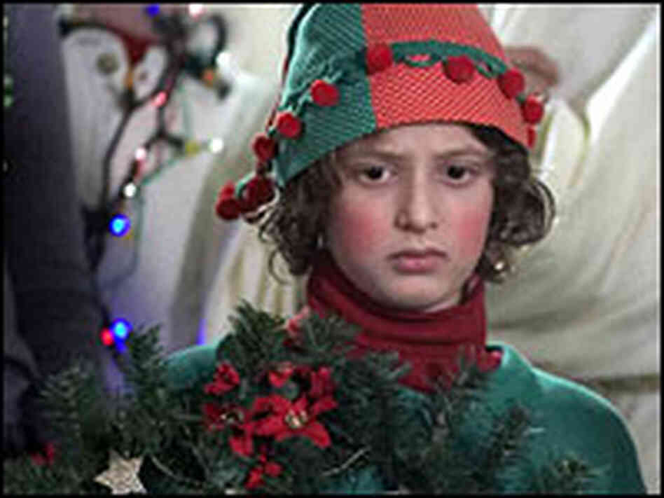 Noah Bernett as Scot in gaudy Christmas outfit